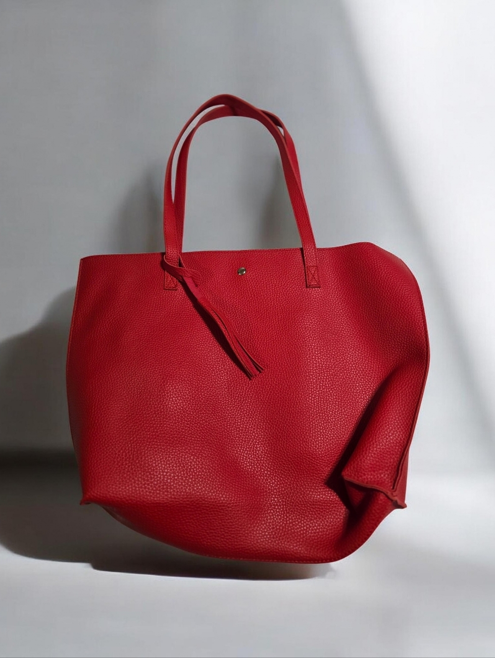 Red  Faux Leather Tote Bag with Tassel Detail. EUC.